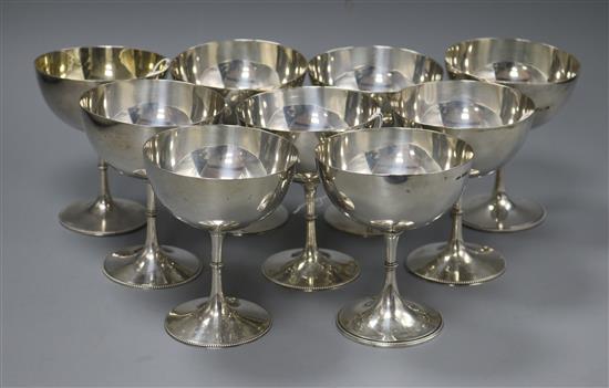 A set of nine near matching silver champagne coupes, total weight approx 33.5oz